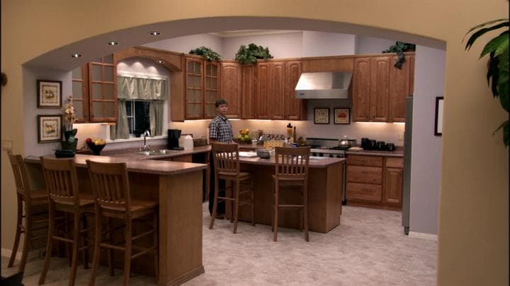 Michael returned to the model home  to find his son in the kitchen.