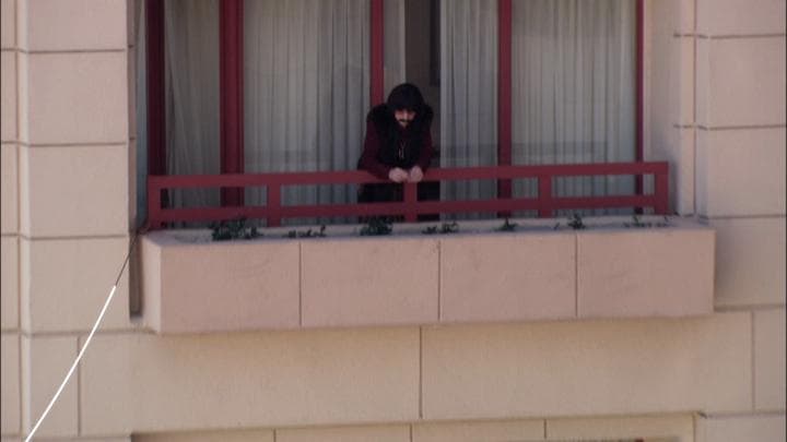 There's a very bored-looking little  Sonny Bono on that balcony.