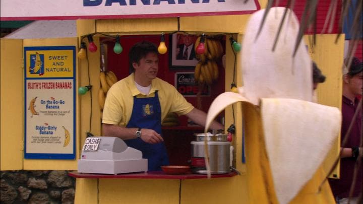 - while his son manned a banana.  - How you doin' there, champ?