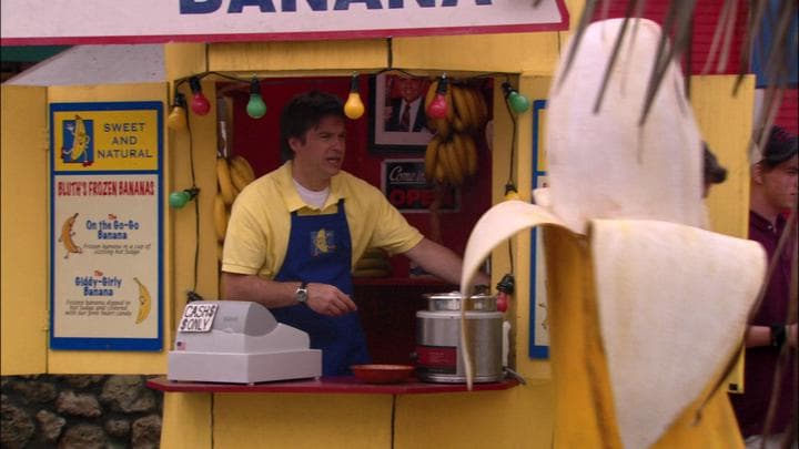 - while his son manned a banana.  - How you doin' there, champ?