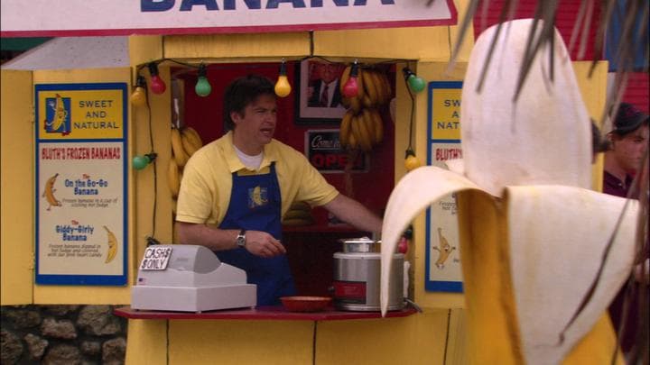 - while his son manned a banana.  - How you doin' there, champ?