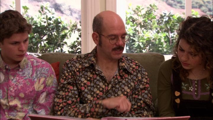 Tobias gives his daughter the gift  he'd stayed up all night making.