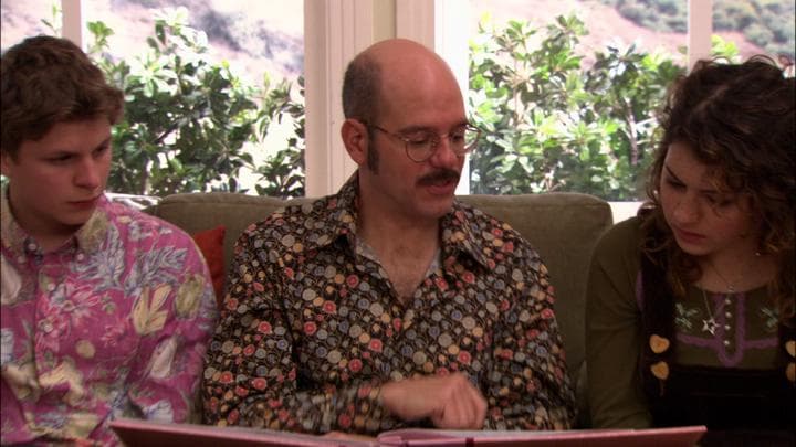 Tobias gives his daughter the gift  he'd stayed up all night making.