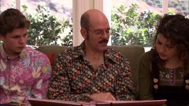 Tobias gives his daughter the gift  he'd stayed up all night making.