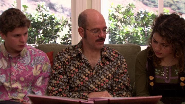 Tobias gives his daughter the gift  he'd stayed up all night making.