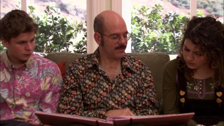 Tobias gives his daughter the gift  he'd stayed up all night making.