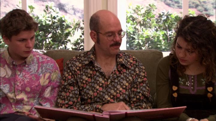 Tobias gives his daughter the gift  he'd stayed up all night making.