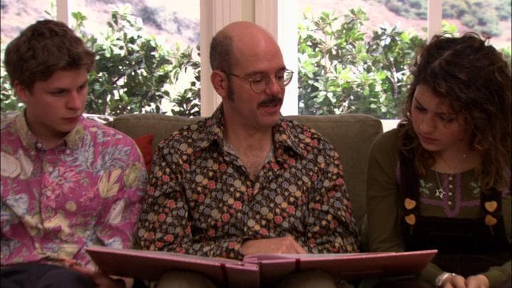 Tobias gives his daughter the gift  he'd stayed up all night making.